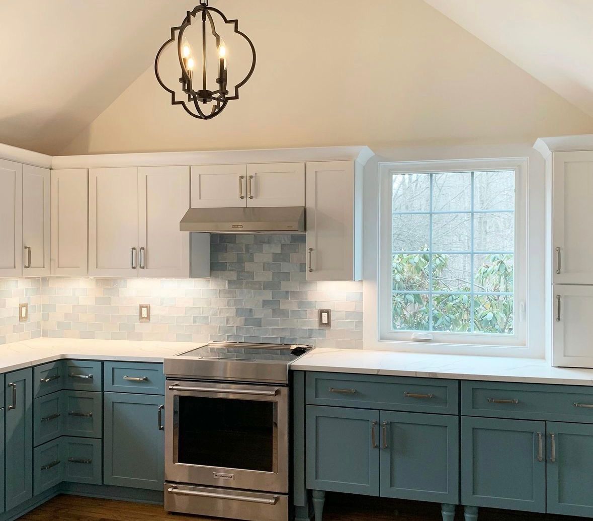 Teal kitchen with subway tile backsplash