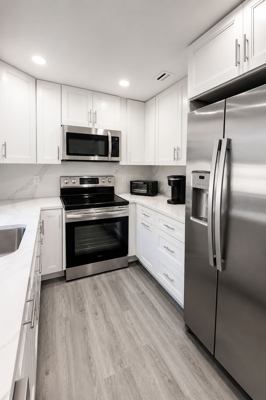 White kitchen with quartz countertops